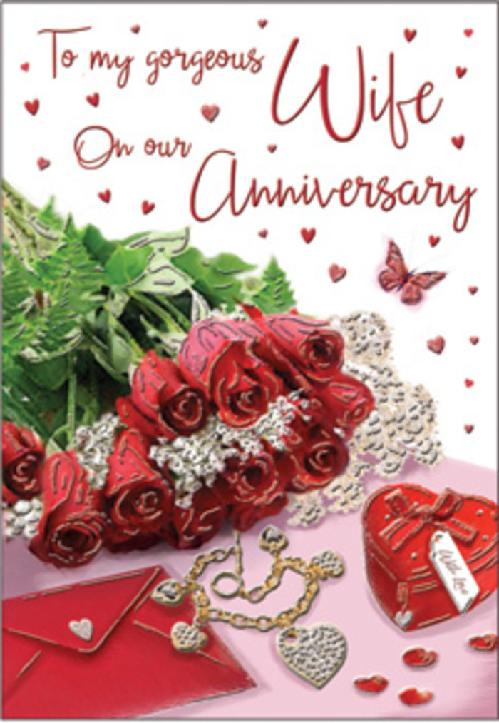 A richly romantic anniversary card scene unfolds as though arranged on a quiet morning table in Muswell Hill, filled with thoughtful details that speak of years spent together. The focal point is a bouquet-style cluster of full red roses, each bloom layered with silky petals in shades of deep crimson and ruby, surrounded by polished green leaves that suggest careful conditioning by an experienced florist. The flowers sit close to a neatly placed envelope, its creamy surface softly curved, ready to carry a handwritten message across the neighbourhoods surrounding Colney Hatch Lane. Nearby, a heart-shaped keepsake box in vivid red anchors the composition, its smooth finish contrasting with the velvety texture of the roses. Beside it, a delicate piece of jewellery rests-perhaps a golden necklace or pendant-forming a quiet loop that hints at enduring commitment. Scattered around the arrangement are glistening, heart-shaped confetti pieces and subtle decorative accents, catching the light like reflections in the windows along Muswell Hill's high street. A single butterfly detail, light and airy, hovers in the design, adding a sense of movement and gentle whimsy. Soft, diffused lighting bathes the entire scene, like afternoon daylight spilling through a bay window, highlighting the rich reds, warm creams, and touches of metallic sheen. The card's scripted wording can be glimpsed but not fully read, evoking the intimacy of private promises. Overall, the image feels like a tender snapshot of an anniversary gift moment, where flowers, keepsakes, and heartfelt words come together to honour a love that has grown deeper with each passing year in this leafy corner of North London.
